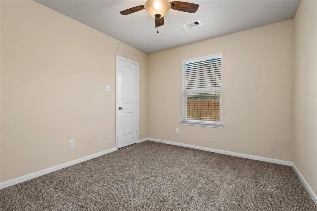 This inviting secondary bedroom features a spacious walk-in closet.