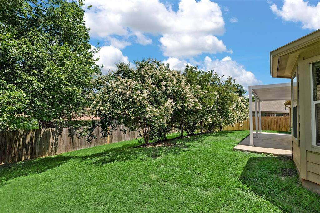 Enjoy ultimate privacy with beautifully landscaped backyard.