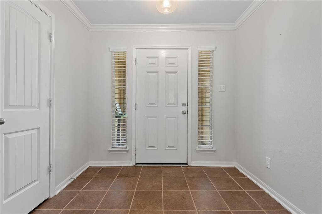Welcoming entryway with convenient coat closet.