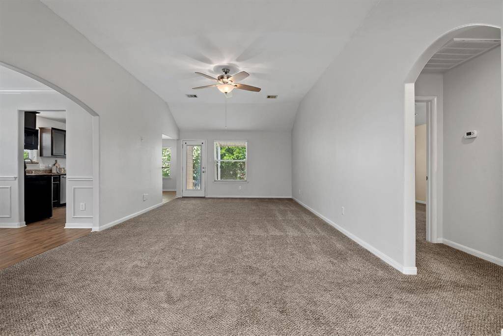Spacious living room with high ceilings.