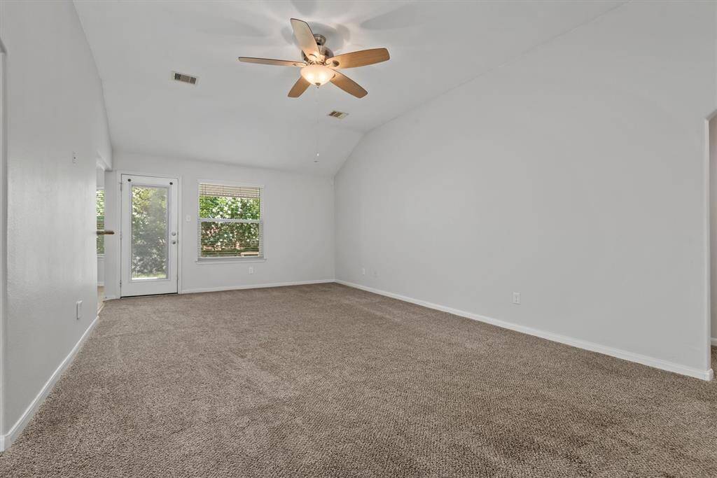 Expansive living room with abundant natural light.