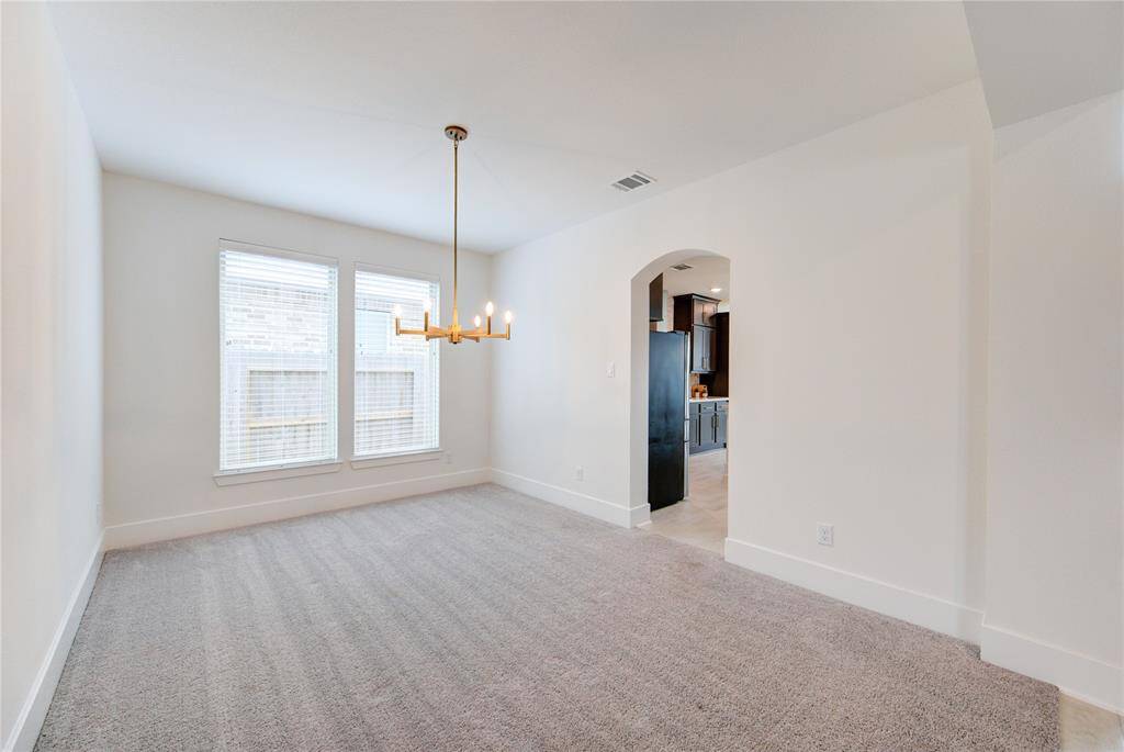 Elegant dining room with abundant natural light, perfect for hosting memorable dinners and gatherings.