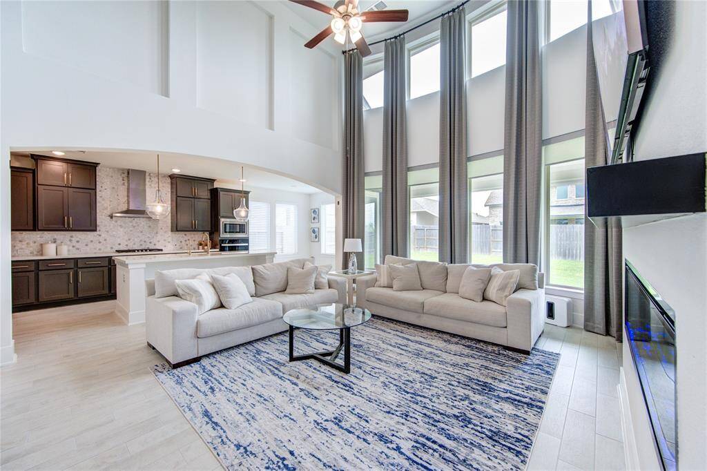 Seamless flow from den to kitchen, perfect for entertaining.