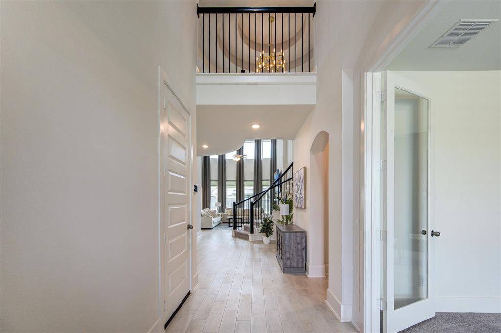 Elegant entryway with stunning custom ceilings.