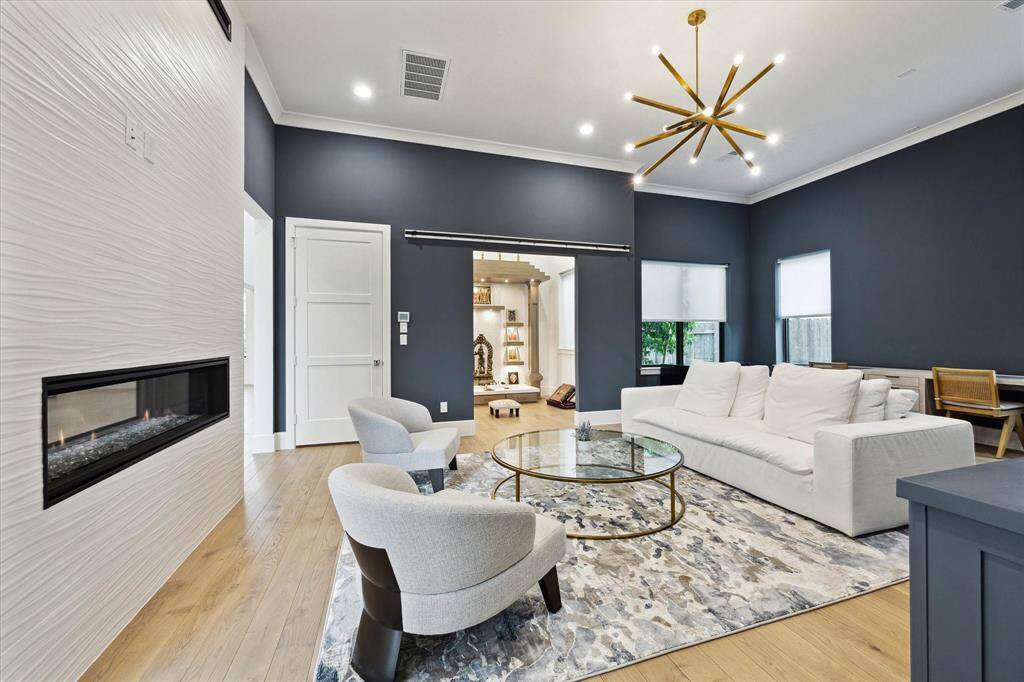 The dual-sided fireplace creates a striking focal point.