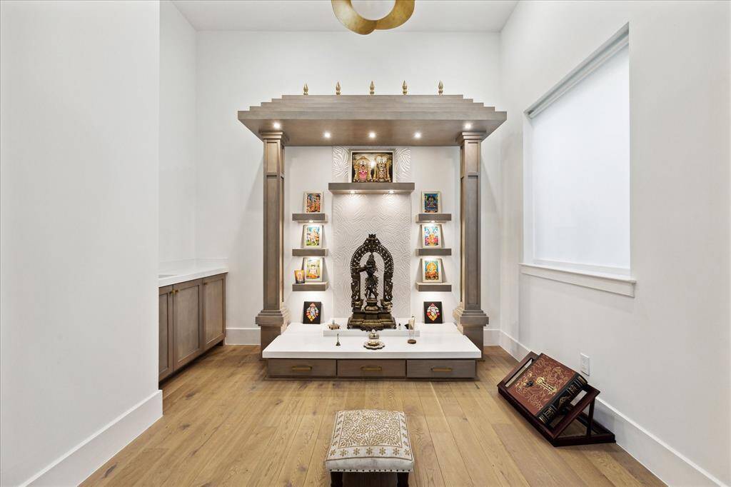 A bonus meditation room with a built-in sink offers versatility as a flex space, ideal for yoga, a workstation , or creative pursuits.