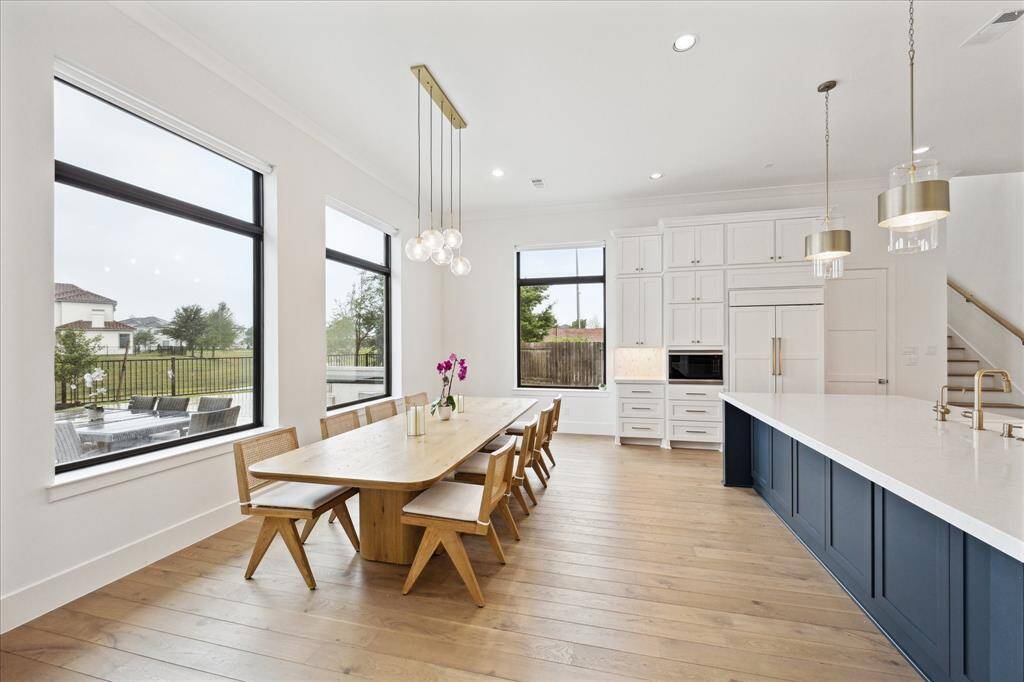 The kitchen is enhanced with stylish shaker-style cabinets, complemented by under-cabinet lighting that adds both warmth and sophistication.