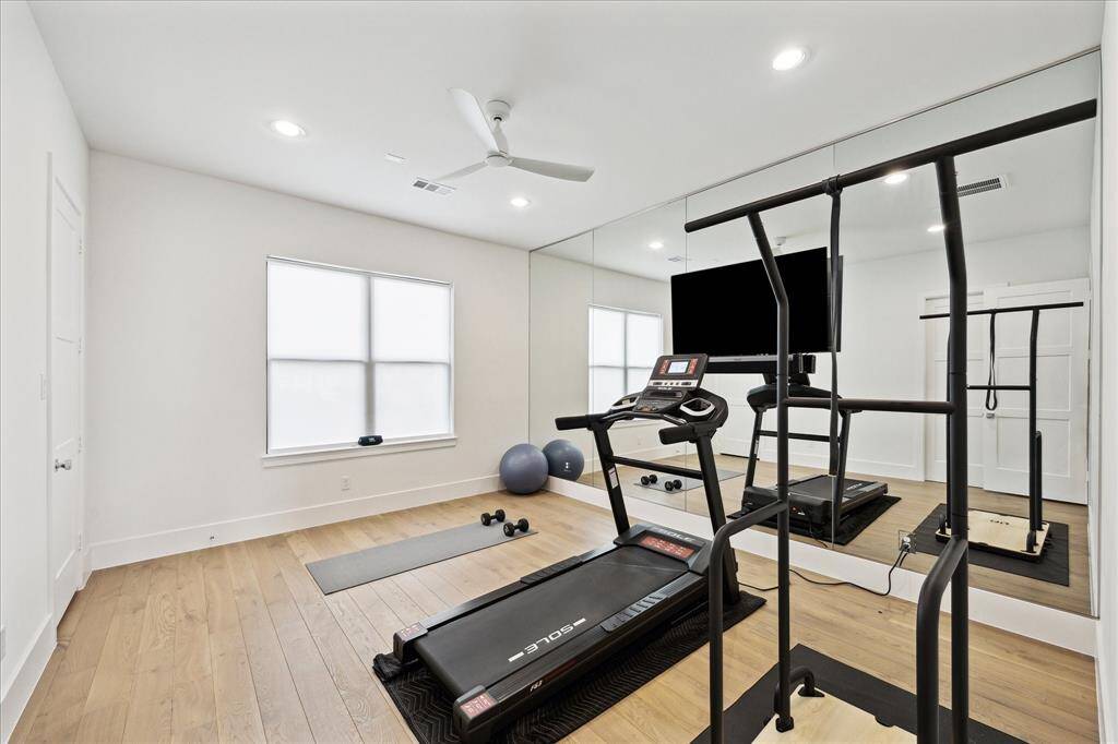 The gym offers versatile space that could easily be converted to a 5th bedroom( it has a closet and direct access to a half bath).