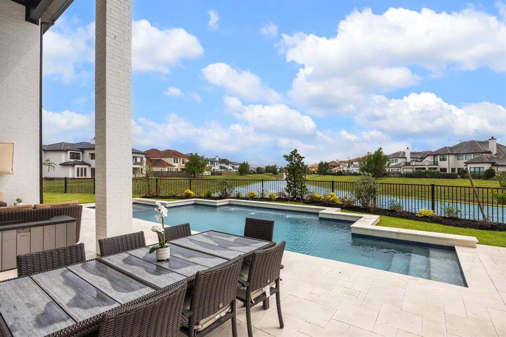 There is ample space to accommodate a large table, perfect for hosting gatherings and creating lasting memories, with an additional gas line installed for a future firepit.