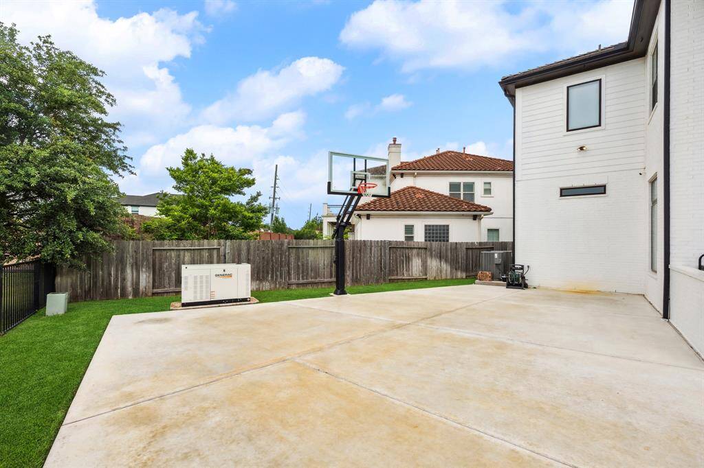 Enjoy peace of mind with a full-home generator. The home also boasts a 33'x36' basketball area.