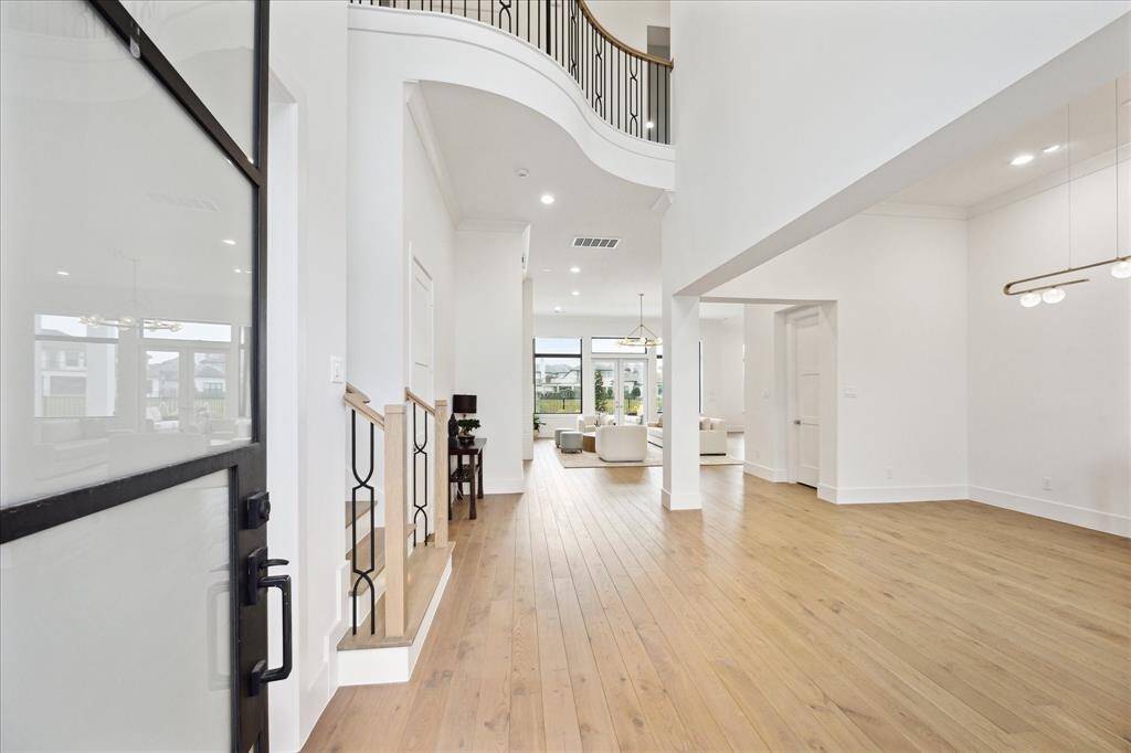 This open-concept home offers sweeping views of the lake. The home is thoughtfully designed with two staircases, and is elevator ready.