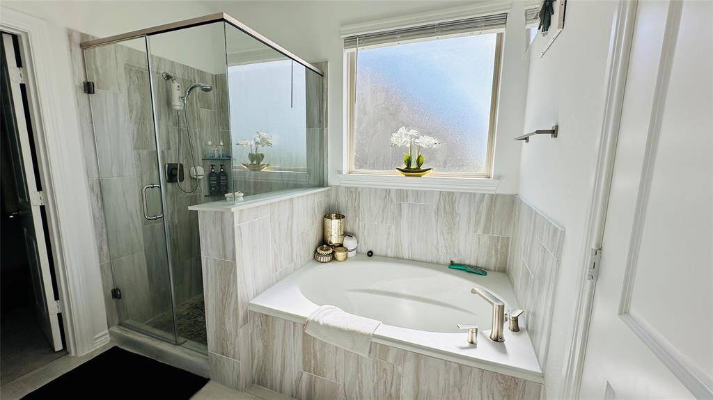 primary bathroom with bathtub