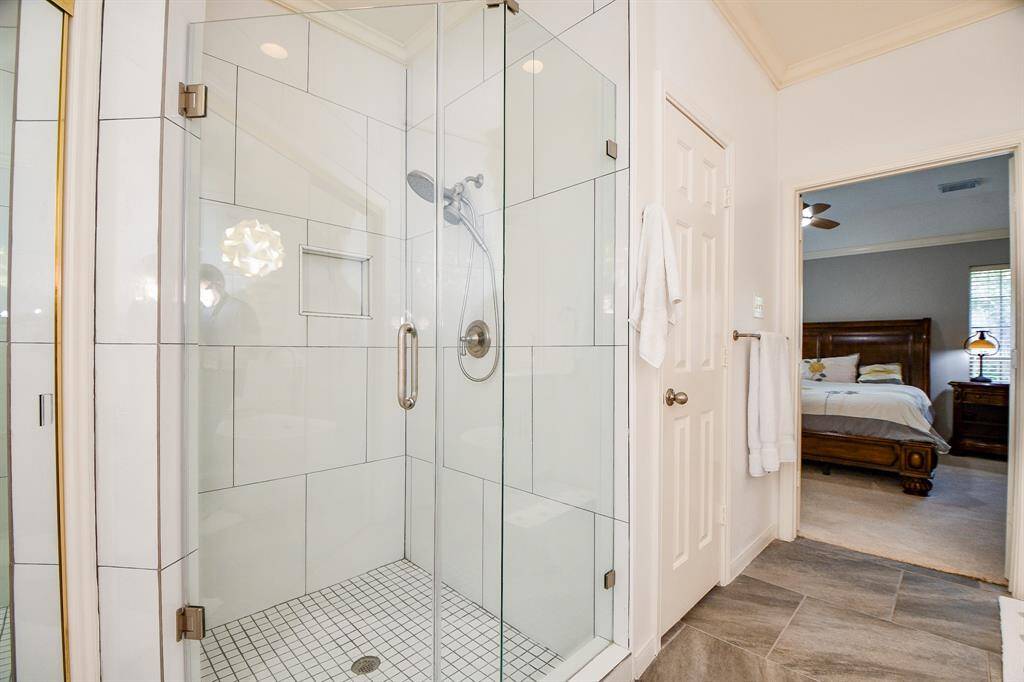 Frameless shower with modern chic tiled walls.