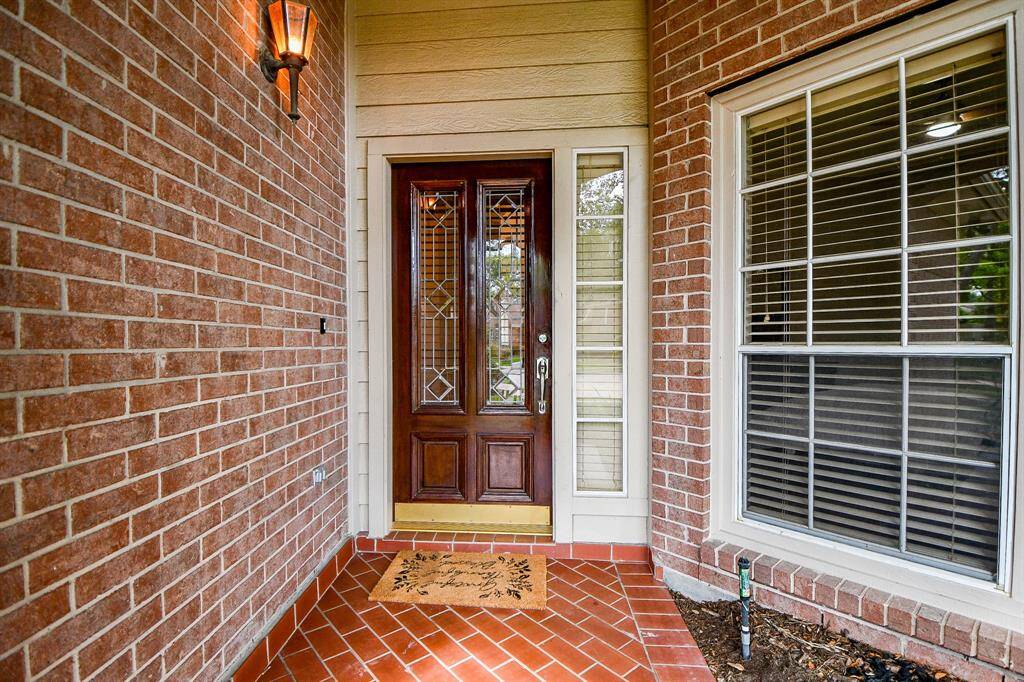Front entry way with beautiful door.