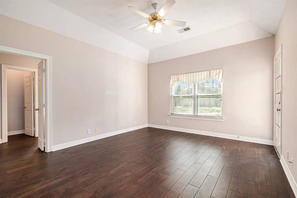 Fantastic primary bedroom with access to the backyard.