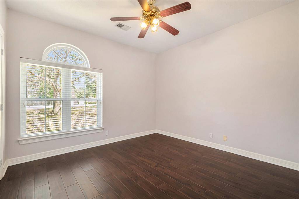 Secondary bedroom with a walk-in closet.