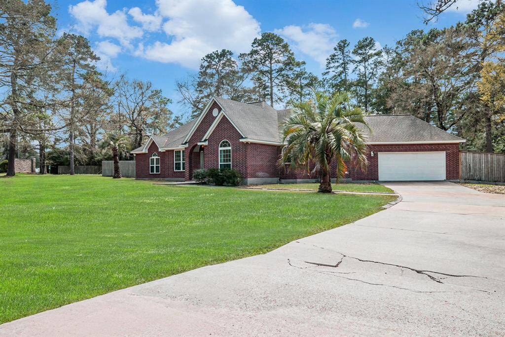 Tons of room for parking in this long driveway leading to the 2-car garage.