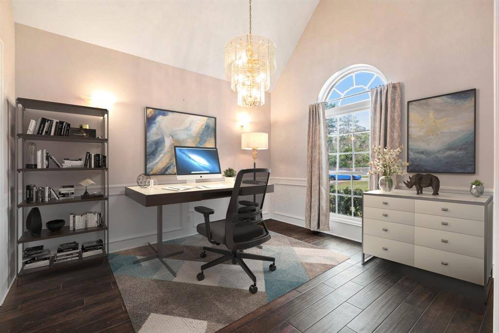 Elegant home office with great views of the front yard. (Virtually Staged)