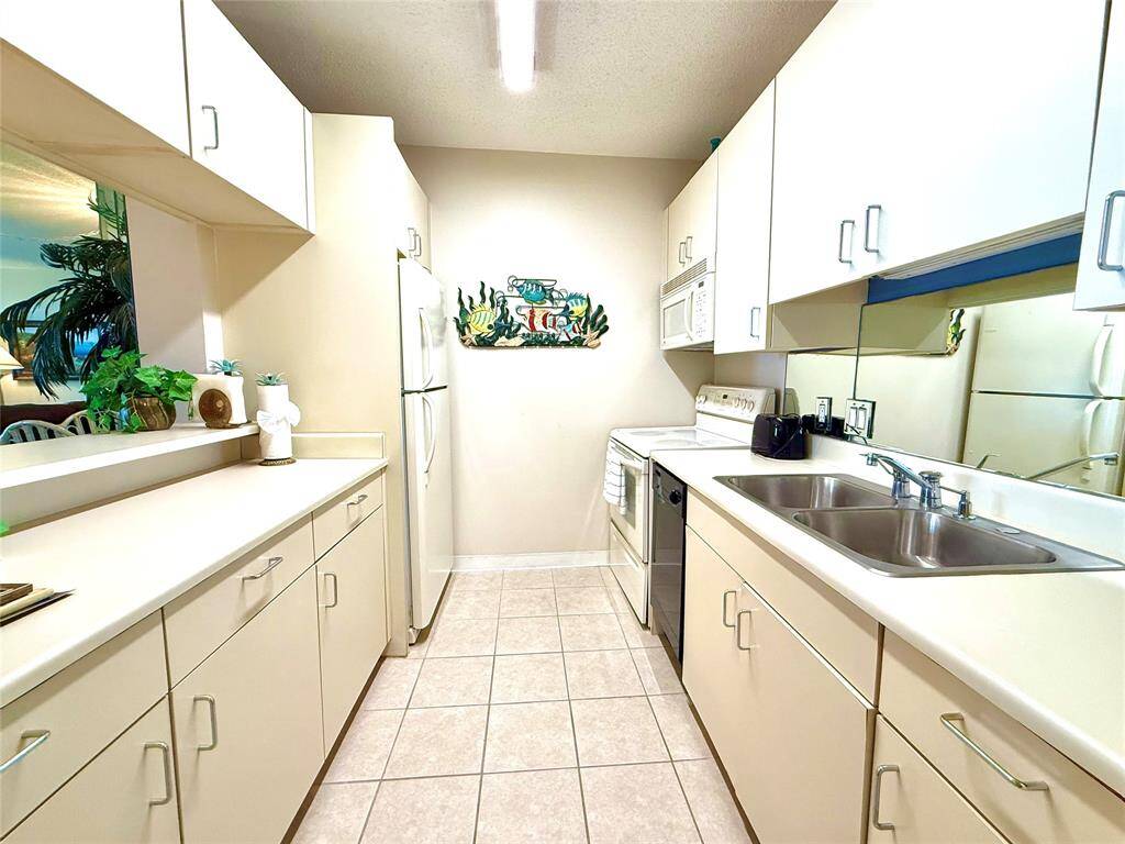 Kitchen open to dining and living room.