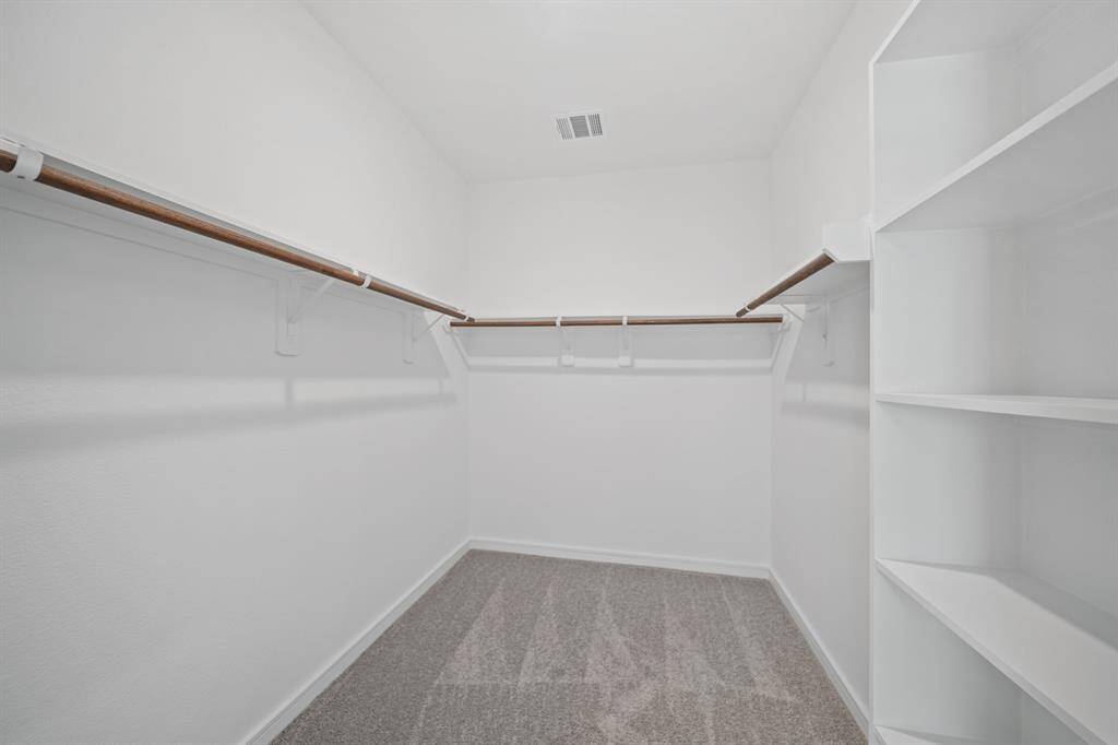 Walk-in closet in primary suite (*Photo not of actual home and used for illustration purposes only.)