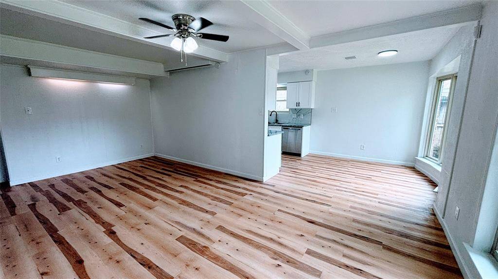 Another view of the open living room space .