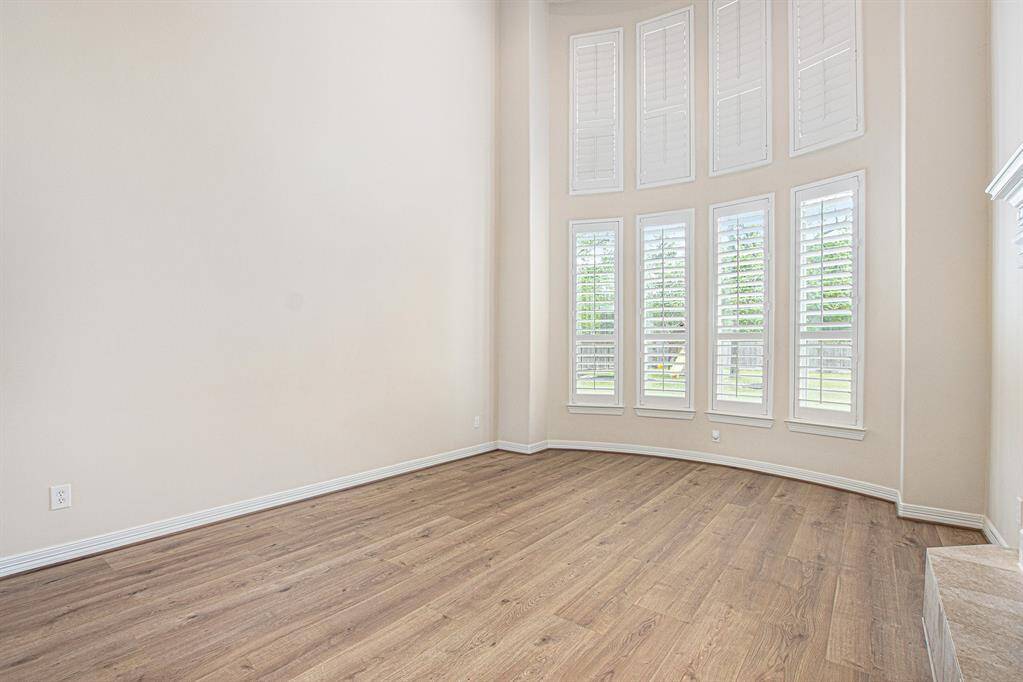 Formal living room has lots of natural light and delightful details from floor to ceiling.
