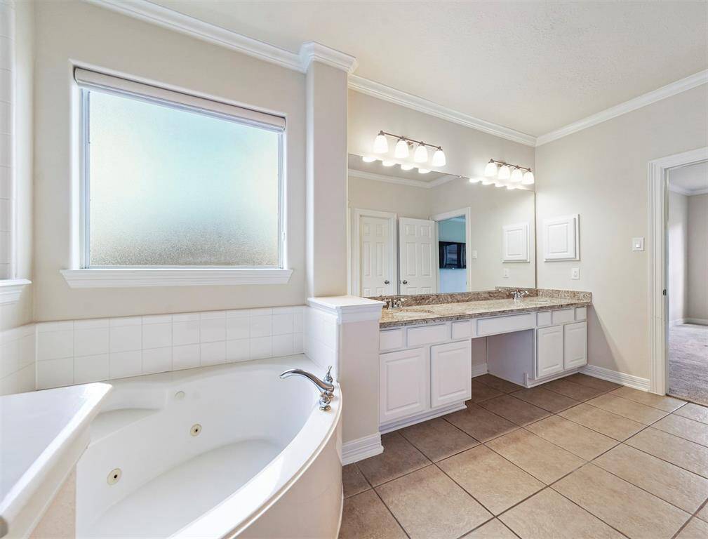 Double sinks and fabulous granite counter tops in the primary spa.