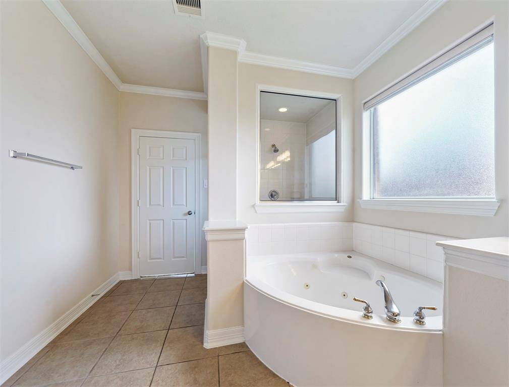 Breathtaking primary spa with a huge soaker tub and separate spacious shower.