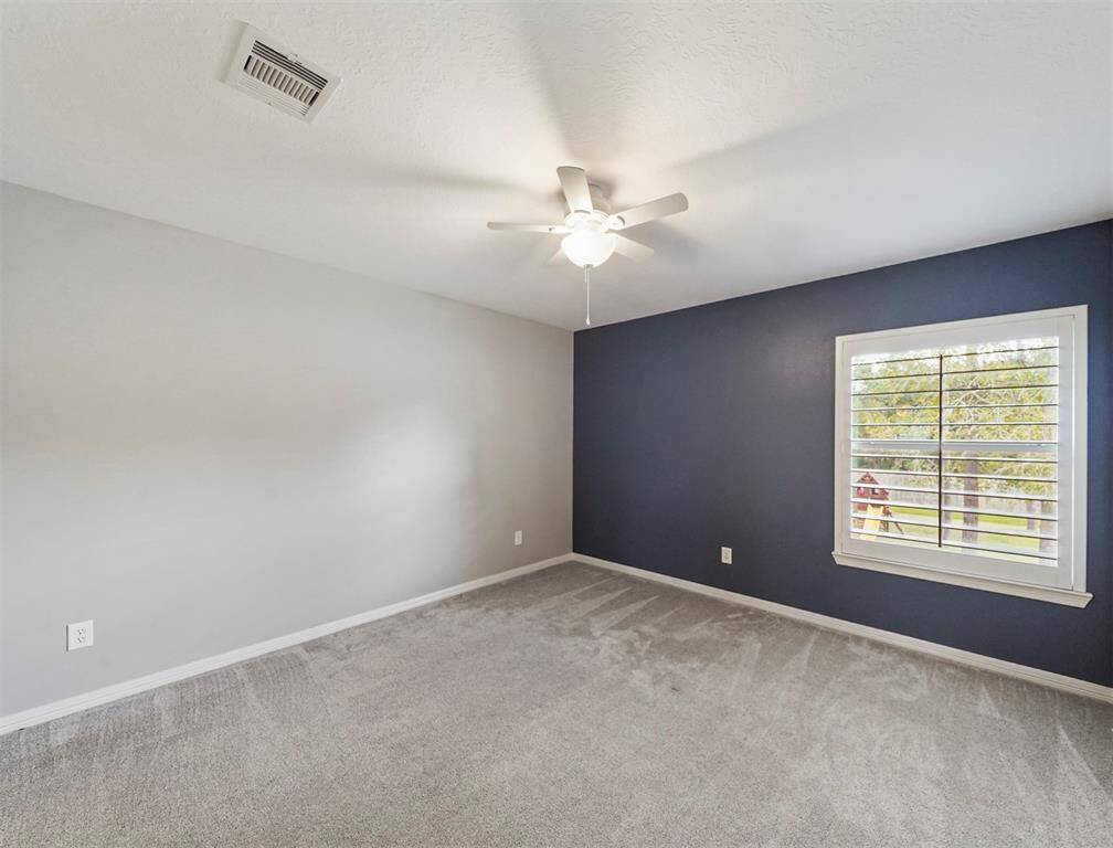 Upstairs secondary bedroom has lots of space to relax and spread out.