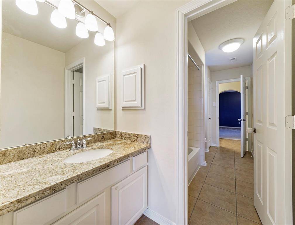 Adorable Hollywood style secondary bathroom.