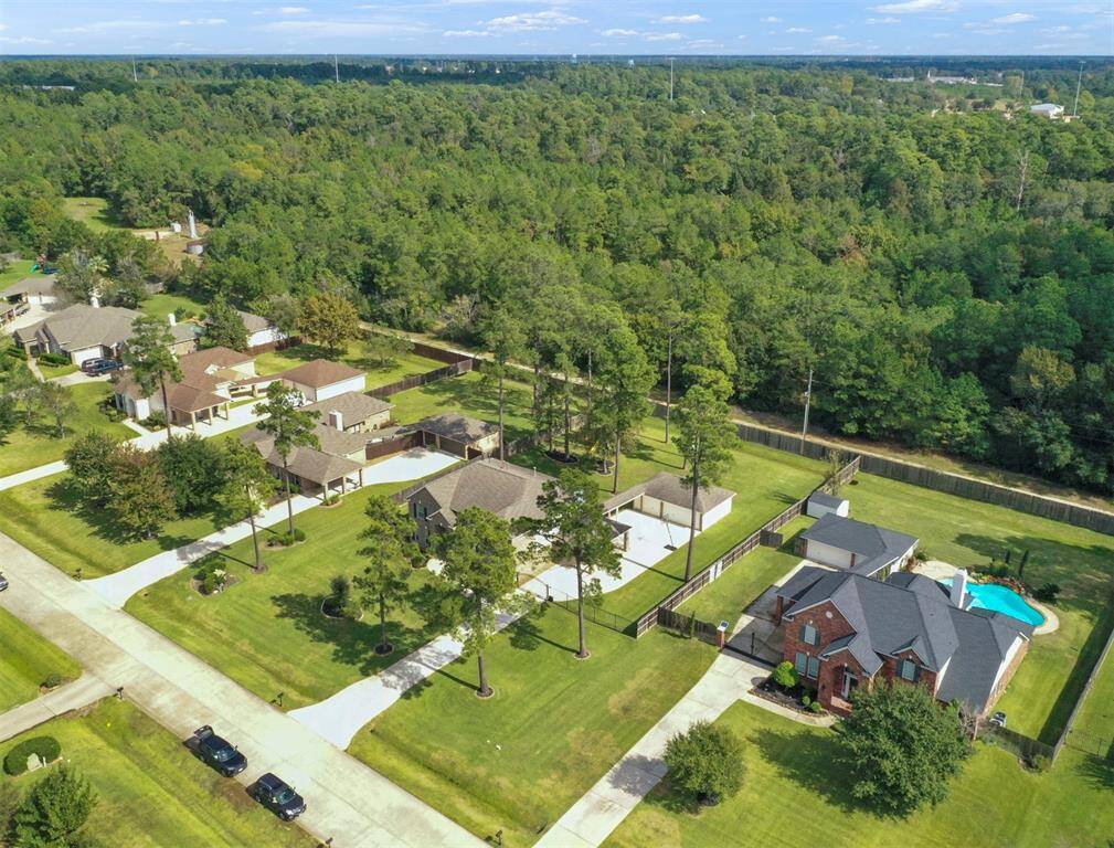 Aerial views showcase this remarkable property—offering unparalleled privacy with no backyard neighbors!