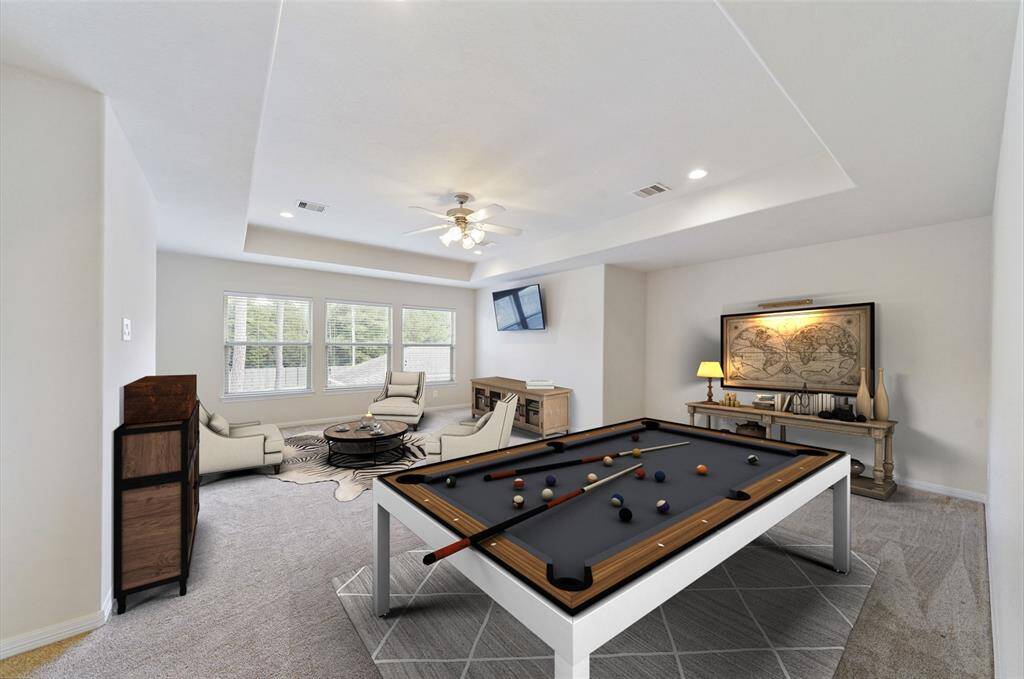 Another view of the massive game room with awesome views of the backyard. Virtually Staged