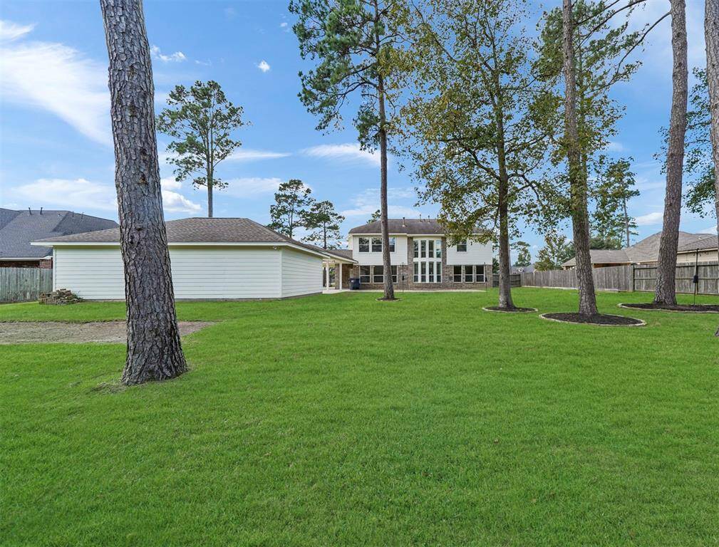 Backyard is equipped with an amazing three car detached garage.