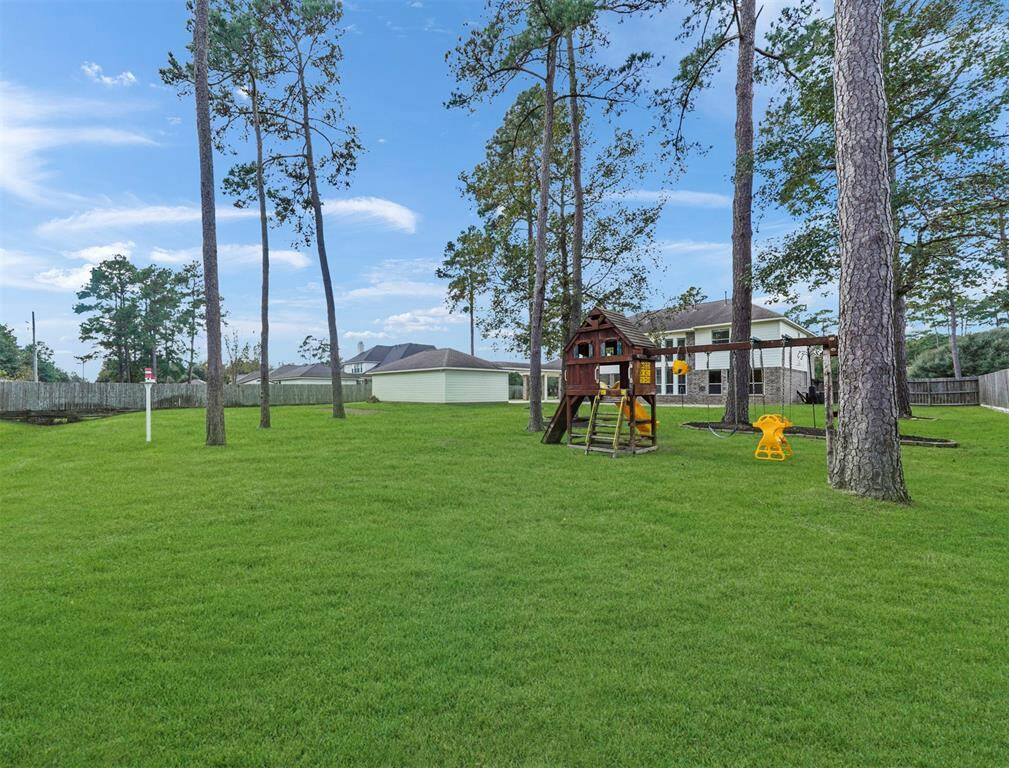 Impressive paved patio overlooking the huge backyard.