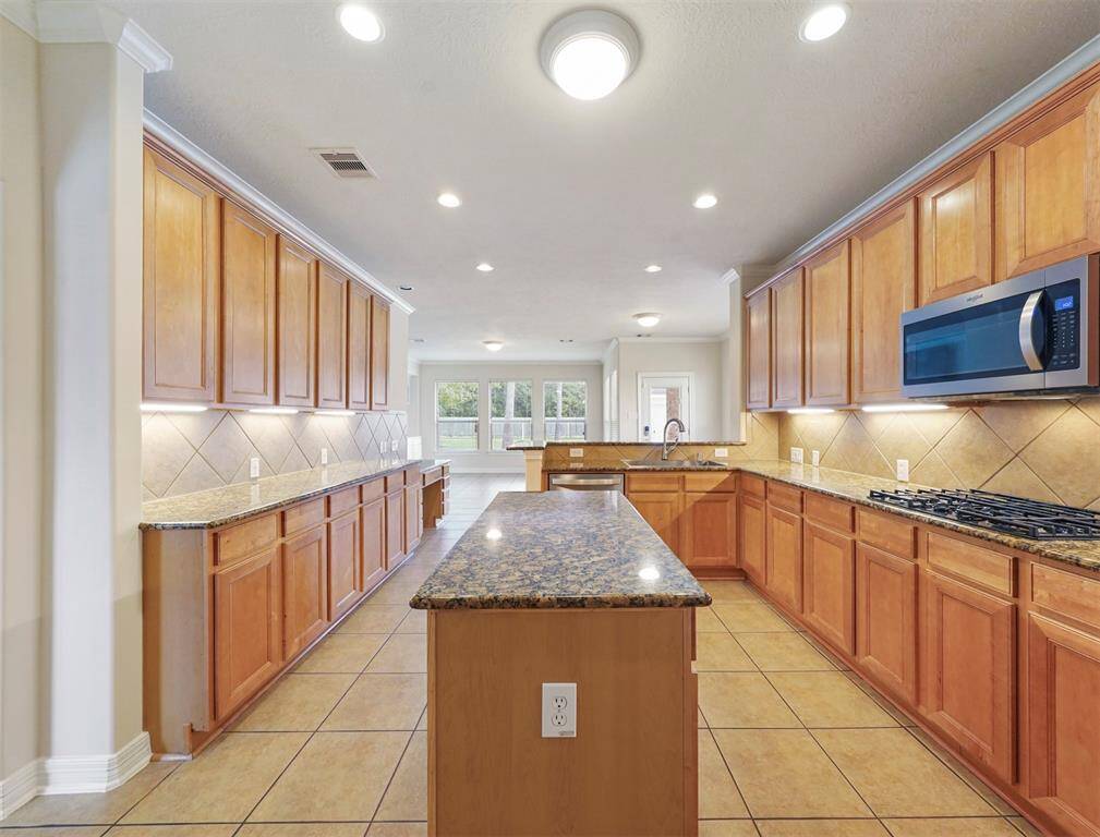 This dream kitchen features stainless appliances and an abundance of preparation space!