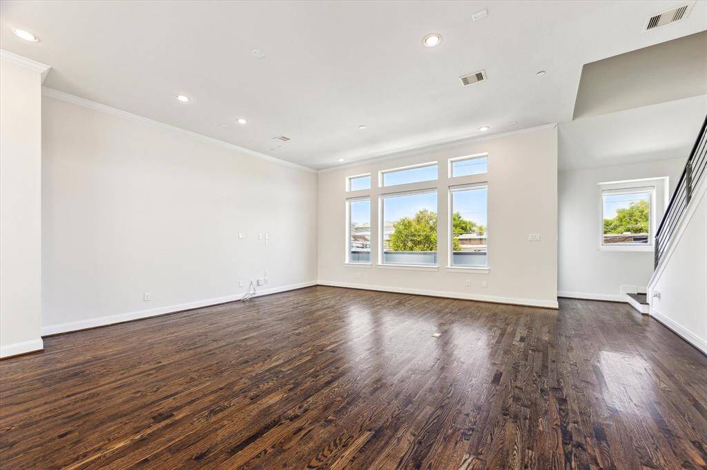 Expansive second-floor open-concept living room and kitchen, designed for seamless flow and perfect for entertaining