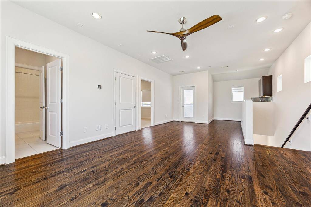 Fourth-floor flex space with a built-in wet bar—perfect for entertaining, a media room, or a private retreat