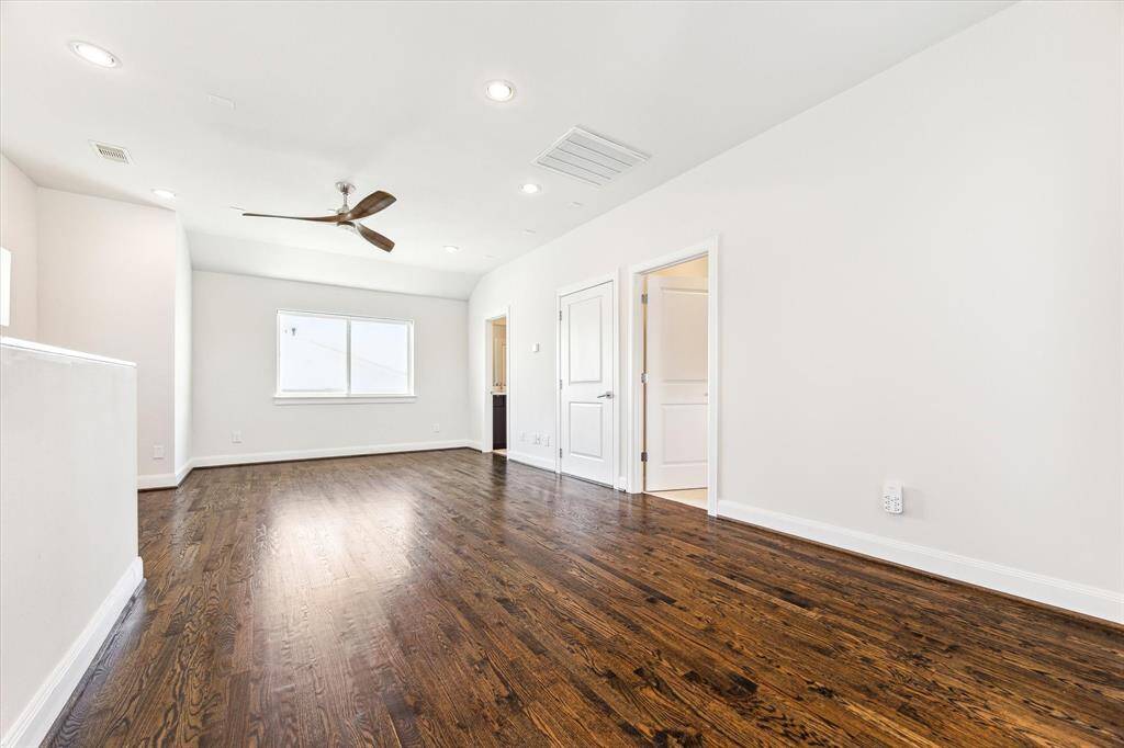 Fourth-floor flex space with a built-in wet bar—perfect for entertaining, a media room, or a private retreat