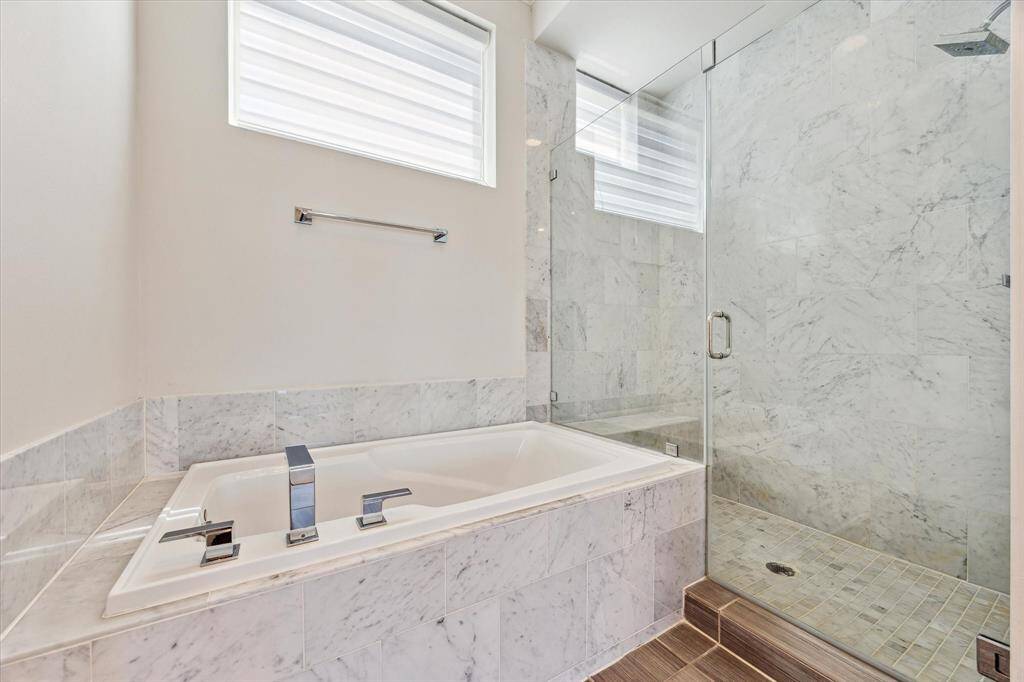 Spa-like primary bathroom featuring luxurious finishes and a serene atmosphere—your personal retreat at home