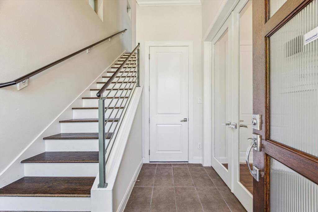 Welcoming front entrance with soaring ceilings that create a grand and spacious first impression