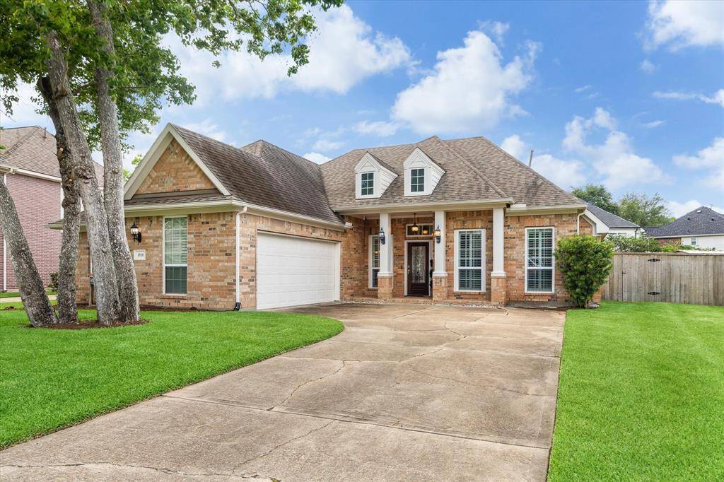 SPACIOUS LOT WITH A BEAUTIFUL BRICK EXTERIOR. SOLAR PANELS INSTALLED IN 2022 PROVIDE ENERGY EFFICIENCY.