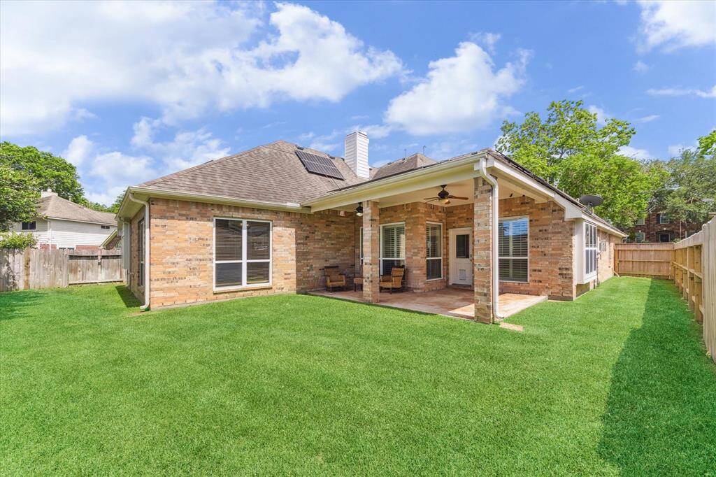 THE FENCED-IN YARD PROVIDES PRIVACY AND ADDED SECURITY.
