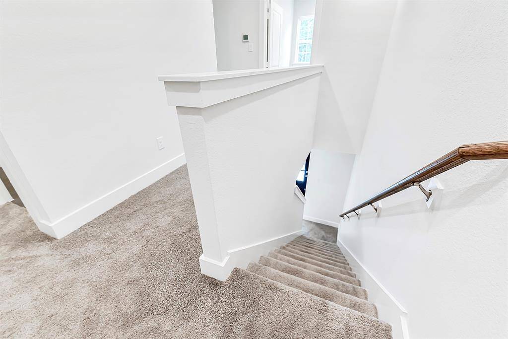 View of stairs to front entry/