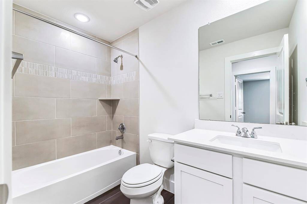 Full bathroom upstairs for bedrooms two and three.