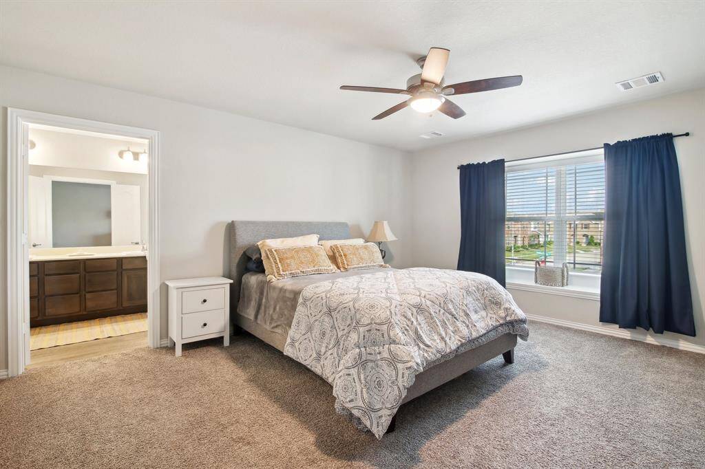 Generously sized primary bedroom offers a relaxing retreat with plenty of room to unwind