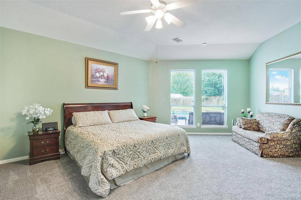 Another view of the bedroom offering ample space for a cozy sitting area.