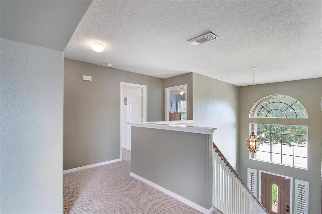 Stairway leading to the inviting second-floor rooms.