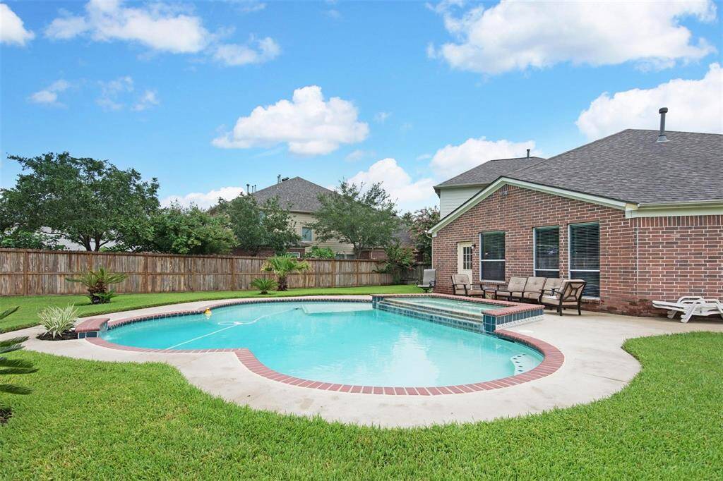 Enjoy a refreshing view of the inviting pool, perfect for relaxation and entertainment.
