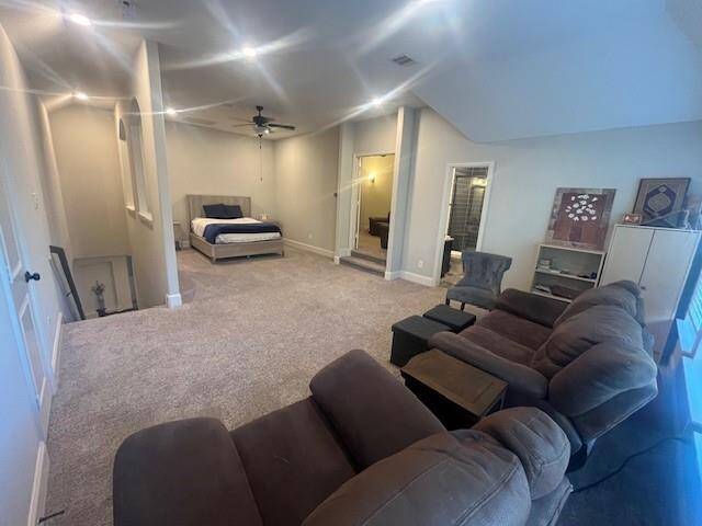 Versatile upstairs retreat offering the perfect blend of comfort and functionality. This spacious area features a cozy sleeping nook, plush carpeting, and ample room for lounging or entertaining. The open layout is ideal for a game room, guest suite, or media space, with recessed lighting and neutral tones enhancing the bright and airy atmosphere. A bonus bathroom and adjacent storage complete this flexible living space.
