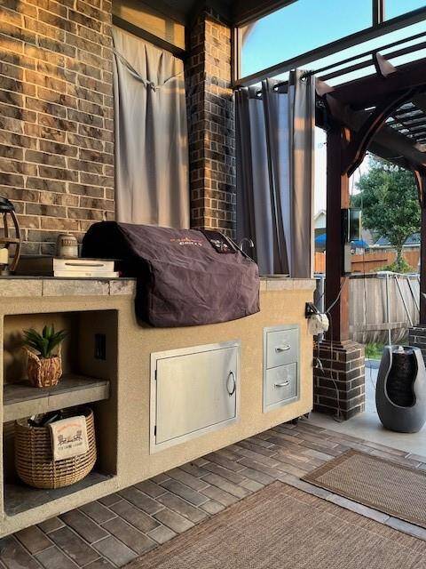 Custom outdoor kitchen on wheels with built-in grill. Not included in the sale but negotiable with the right offer.